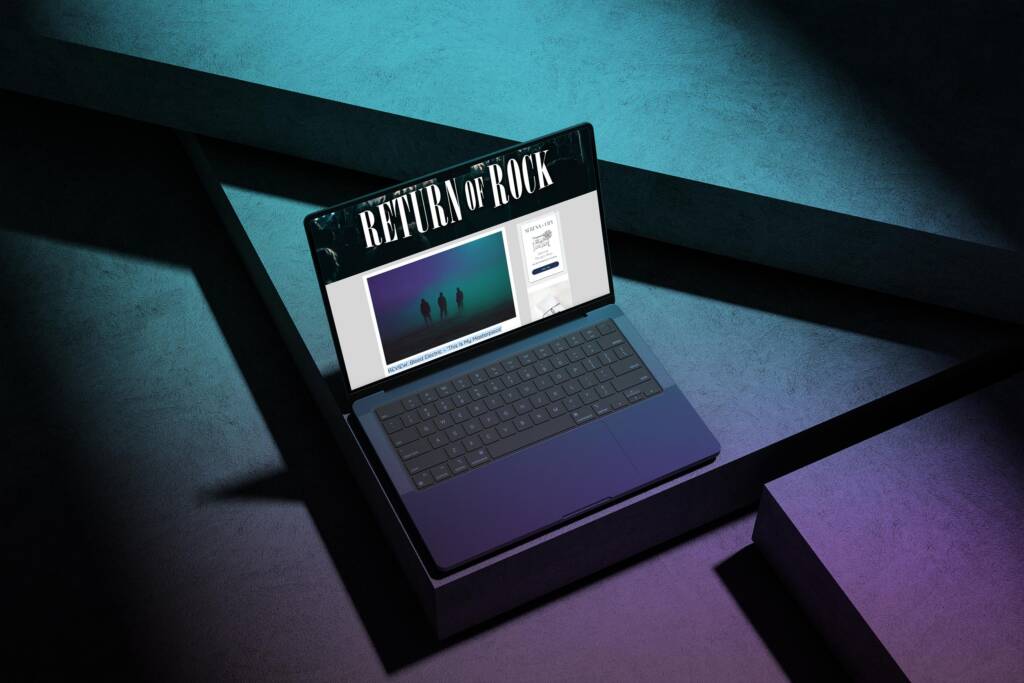 Laptop showing Return of Rock’s review of Bleed Electric’s ‘This Is My Masterpiece’ on a moody teal–purple set