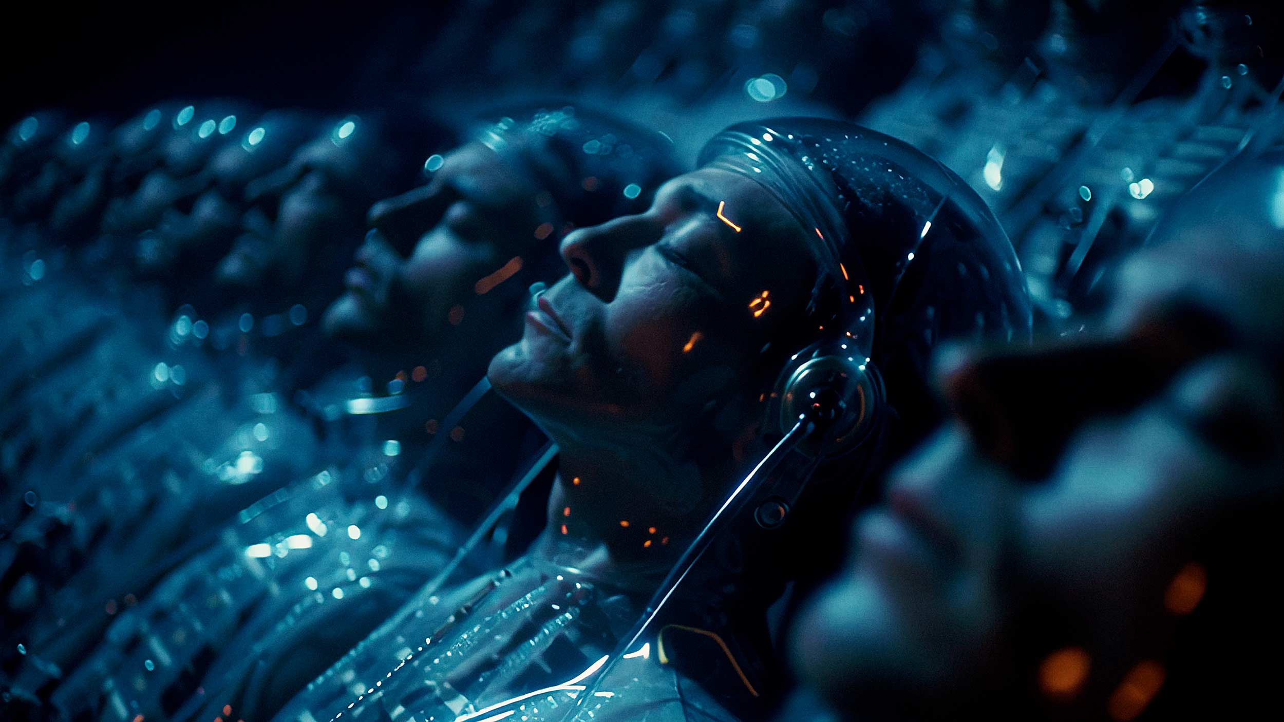 Rows of futuristic sleepers lying in translucent pods with blue lighting and metallic reflections